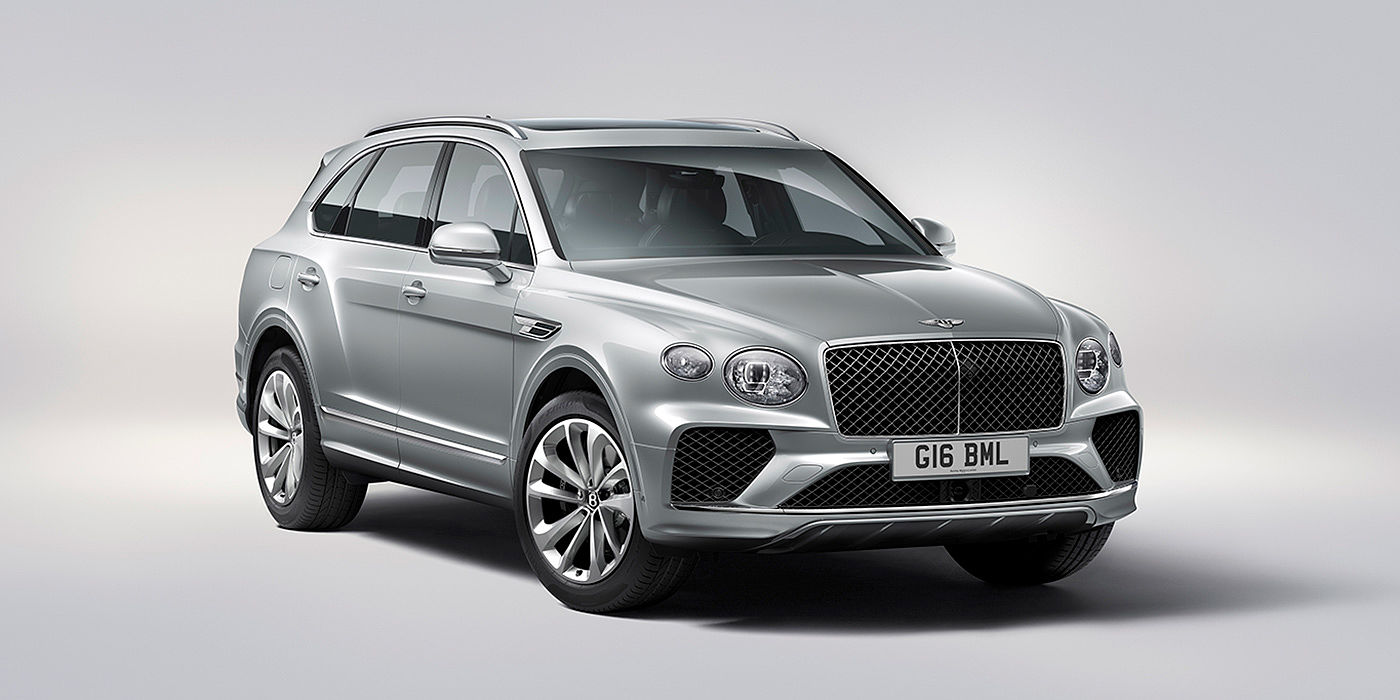 Bentley Beijing - Wukesong Bentley Bentayga in Moonbeam paint, front three-quarter view, featuring a matrix grille and elliptical LED headlights.