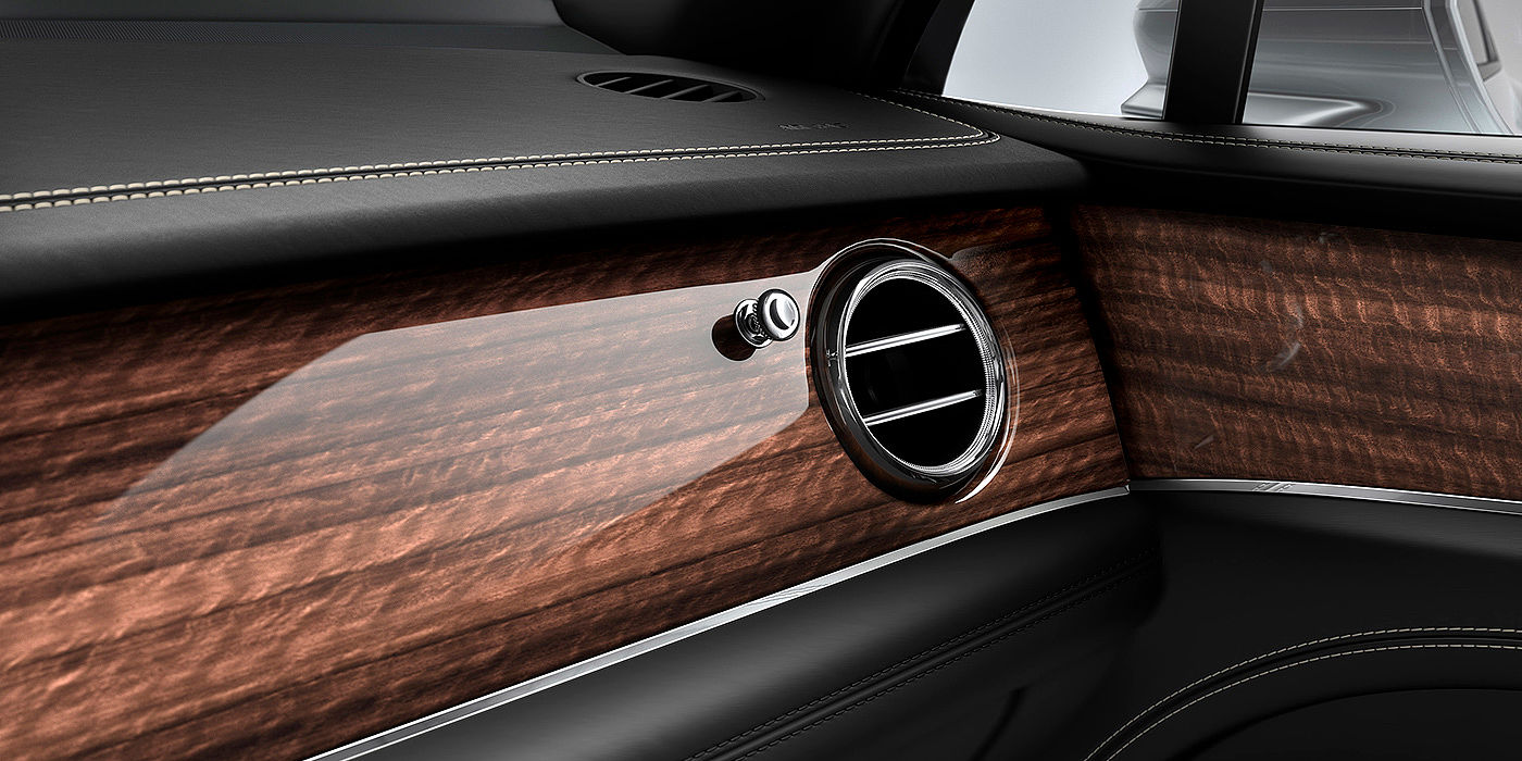 Bentley Beijing - Wukesong Bentley Bentayga front interior Crown Cut Walnut veneer and chrome air vent.
